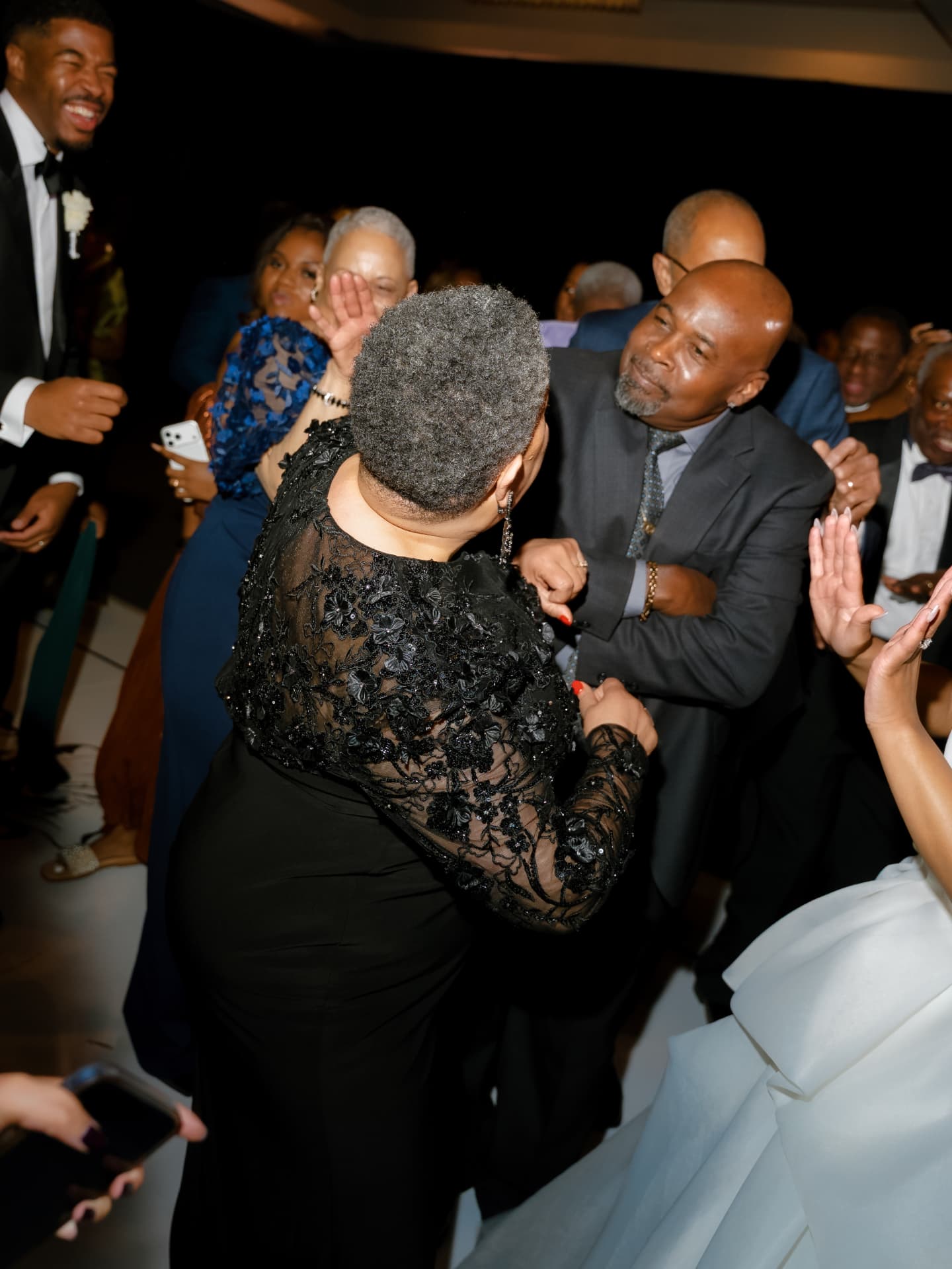 Wedding guests celebrating on the dance floor
